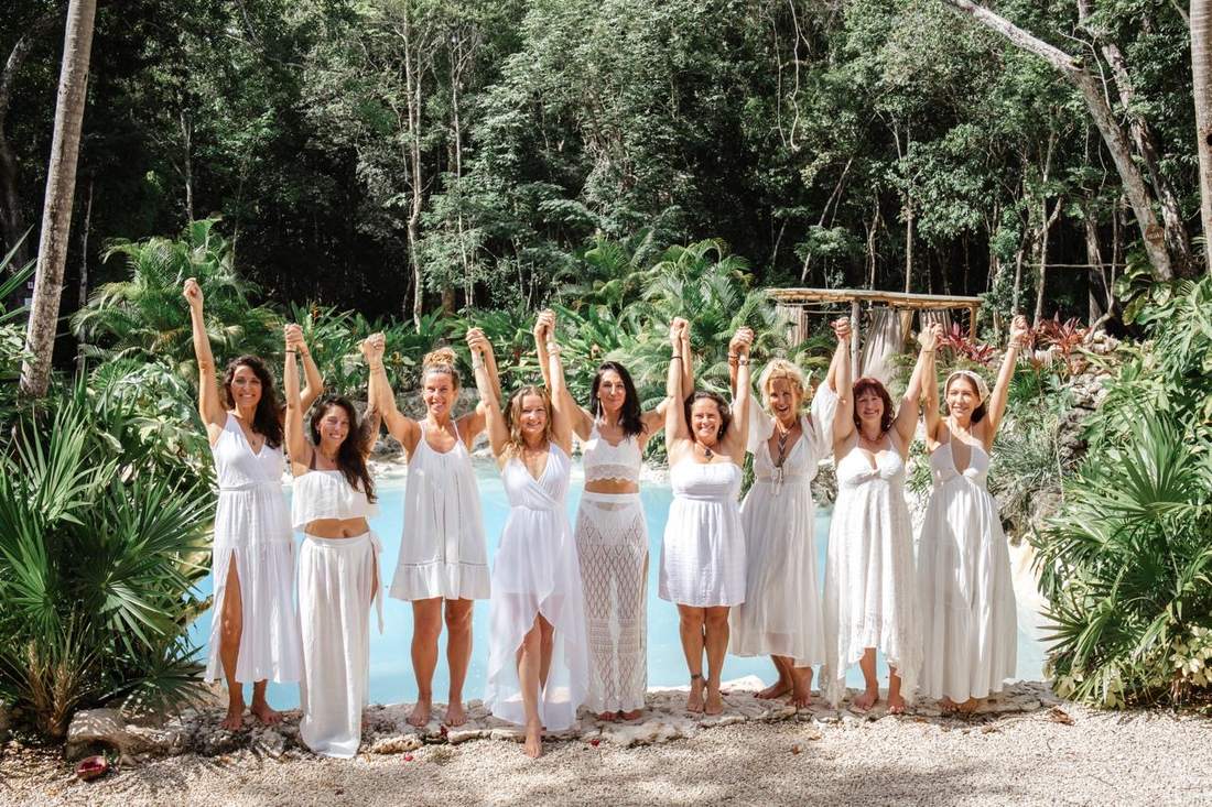 Nine women in white at the cenote, Her Sacred Rebirth Tulum
